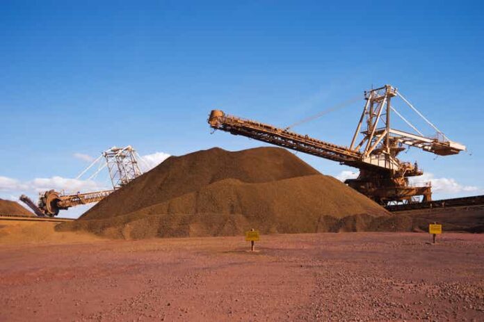 Reclaimer Stacker and Stockpile on Iron Ore Mine Site