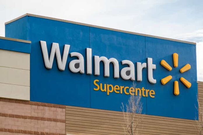 A Walmart supercentre sign at an entrance.