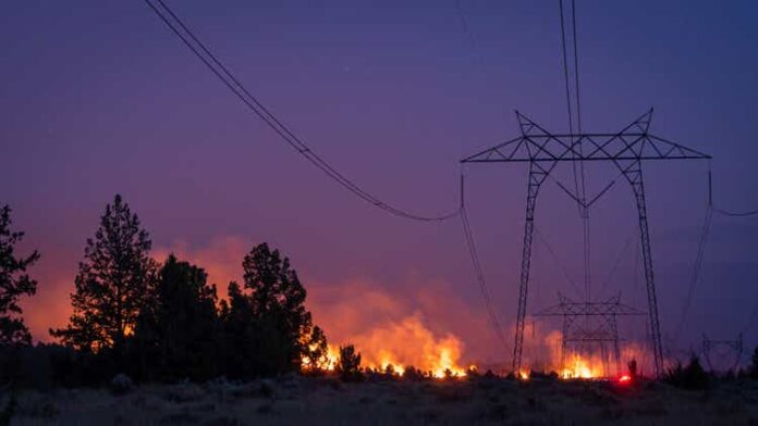 wildfire under electrical transmission line