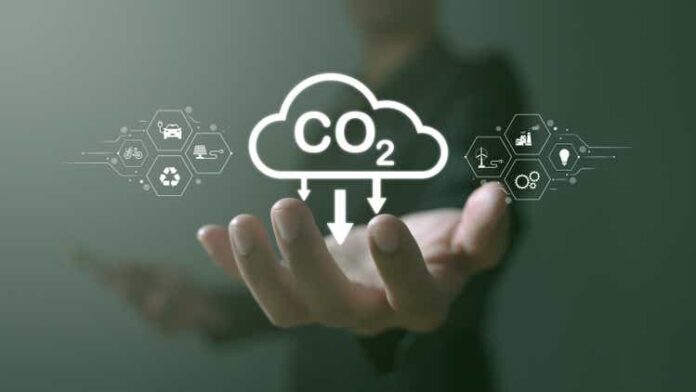 Concept of global warming, greenhouse gases, man holding carbon reduction icon. net zero and carbon neutrality, carbon emissions, carbon neutrality