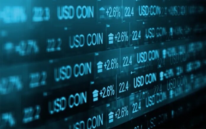 Photo of USD Coin price ticker with up arrows on +2.6% 22.4.