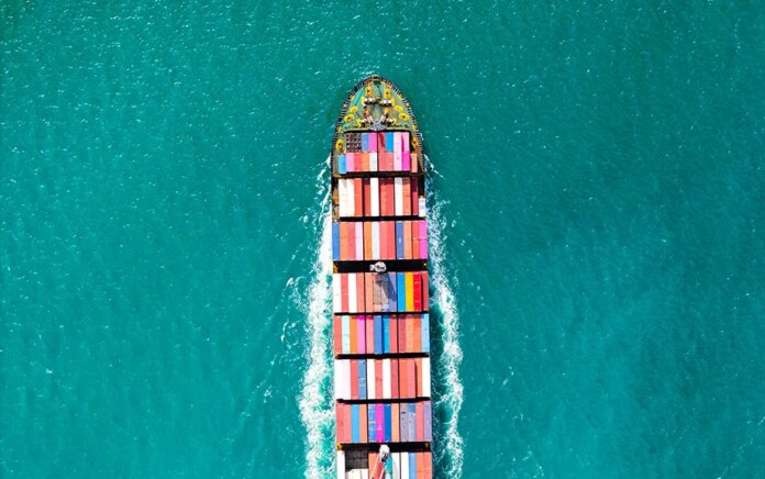 Photo: Shipping container in the middle of the ocean.