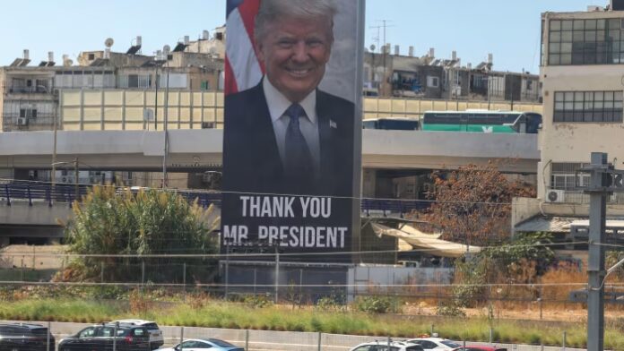 A large billboard in Tel Aviv shows a portrait of US President Donald Trump with the words &quot;THANK YOU MR. PRESIDENT” as cars drive past.